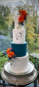 teal and orange wedding cake