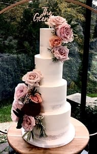 seminaked wedding cake with fresh flowers