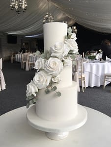 white wedding cake with white flowers