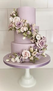 lilac wedding cake with spiral of sugar flowers